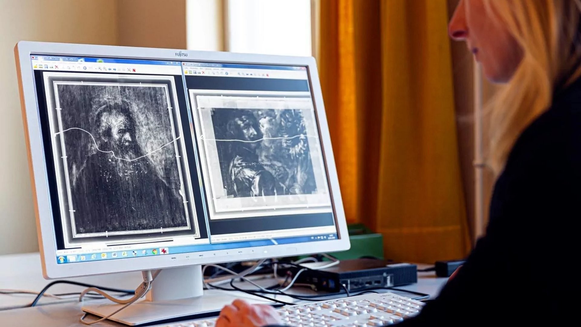 a woman in front of a screen